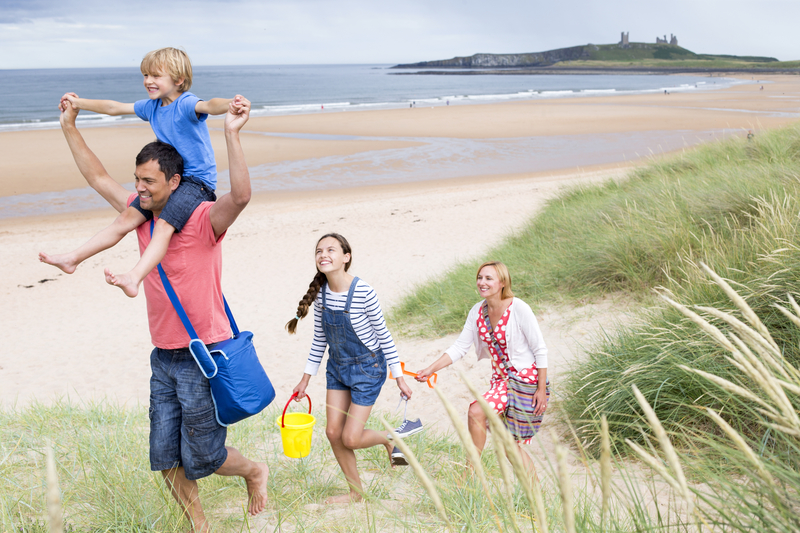 Family leaving the beach Sightseeing Tours Across Sussex